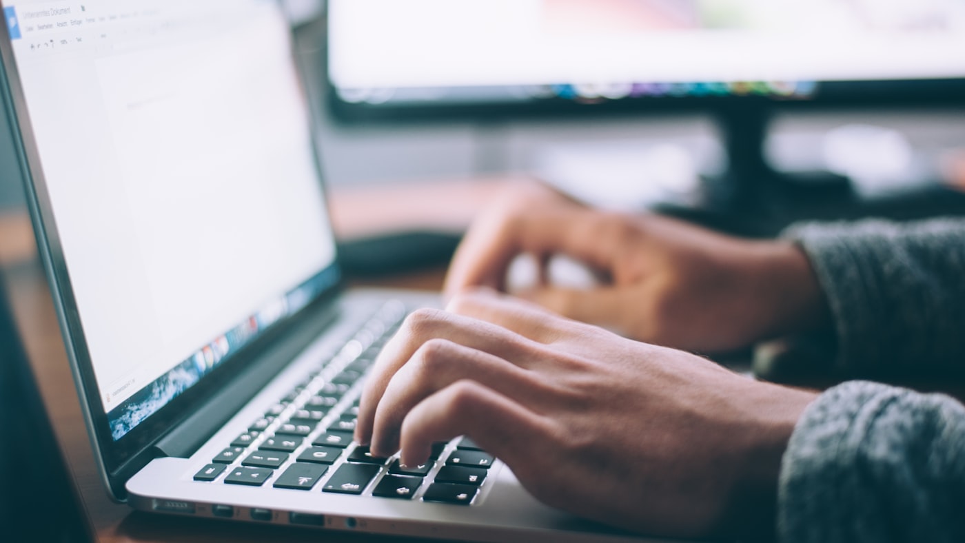 Hands on a keyboard — the gap between designing a thing and shipping it
