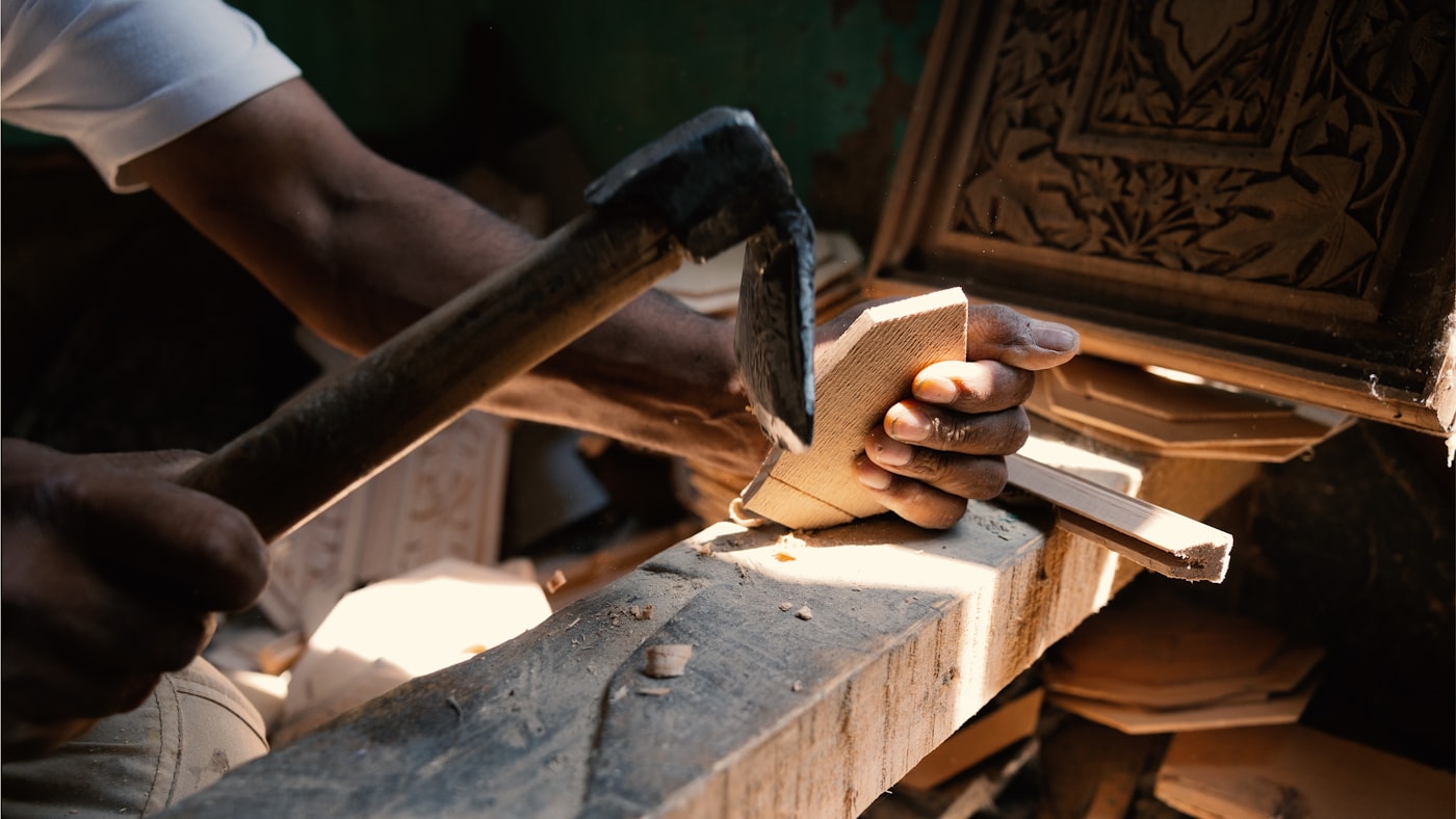 Hand tools on a workshop wall — the craft is choosing which one to reach for