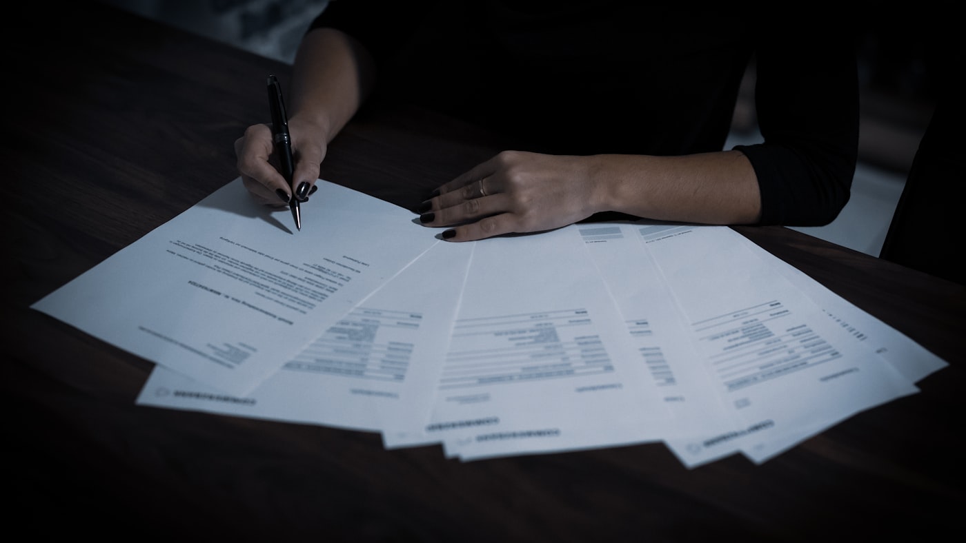 A desk covered in paperwork — the workflow an enterprise tool is really competing against
